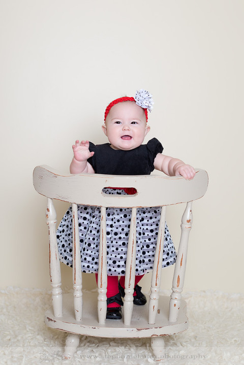 9 month old standing on chair